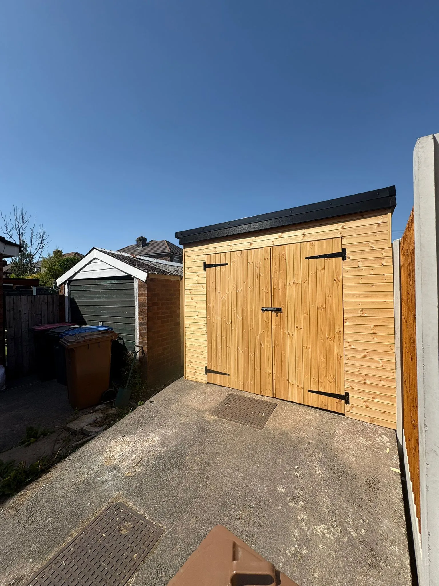 Completed bespoke timber garden outbuilding by LDG Joinery LTD, Bolton