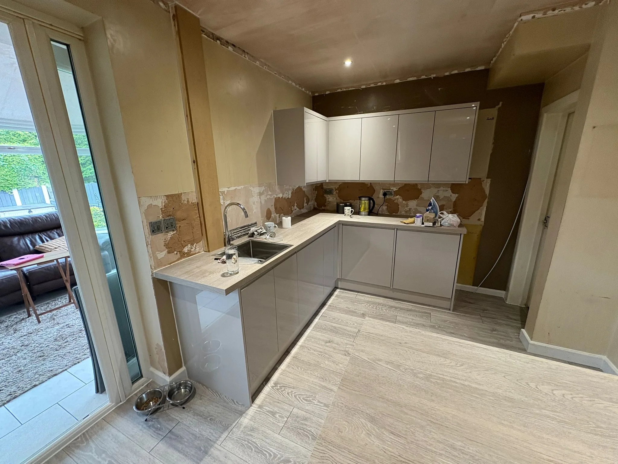 Gloss fitted kitchen installation in progress by LDG Joinery LTD